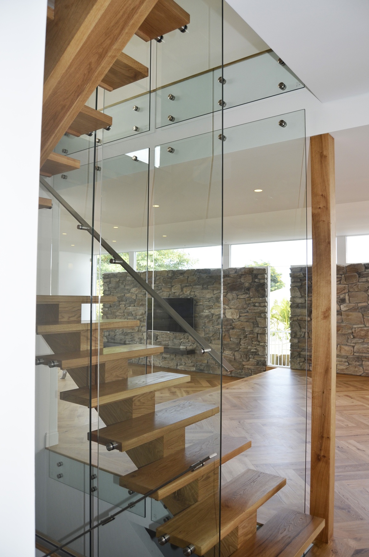 Curved Internal Staircase Curved internal timber staircase with steel balustrade in a modern Brisbane home